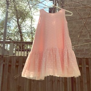 A pink polka dotted dress